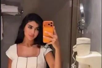 كارولين عزمي تتألق بإطلالة أنيقة في فستان أبيض جديد